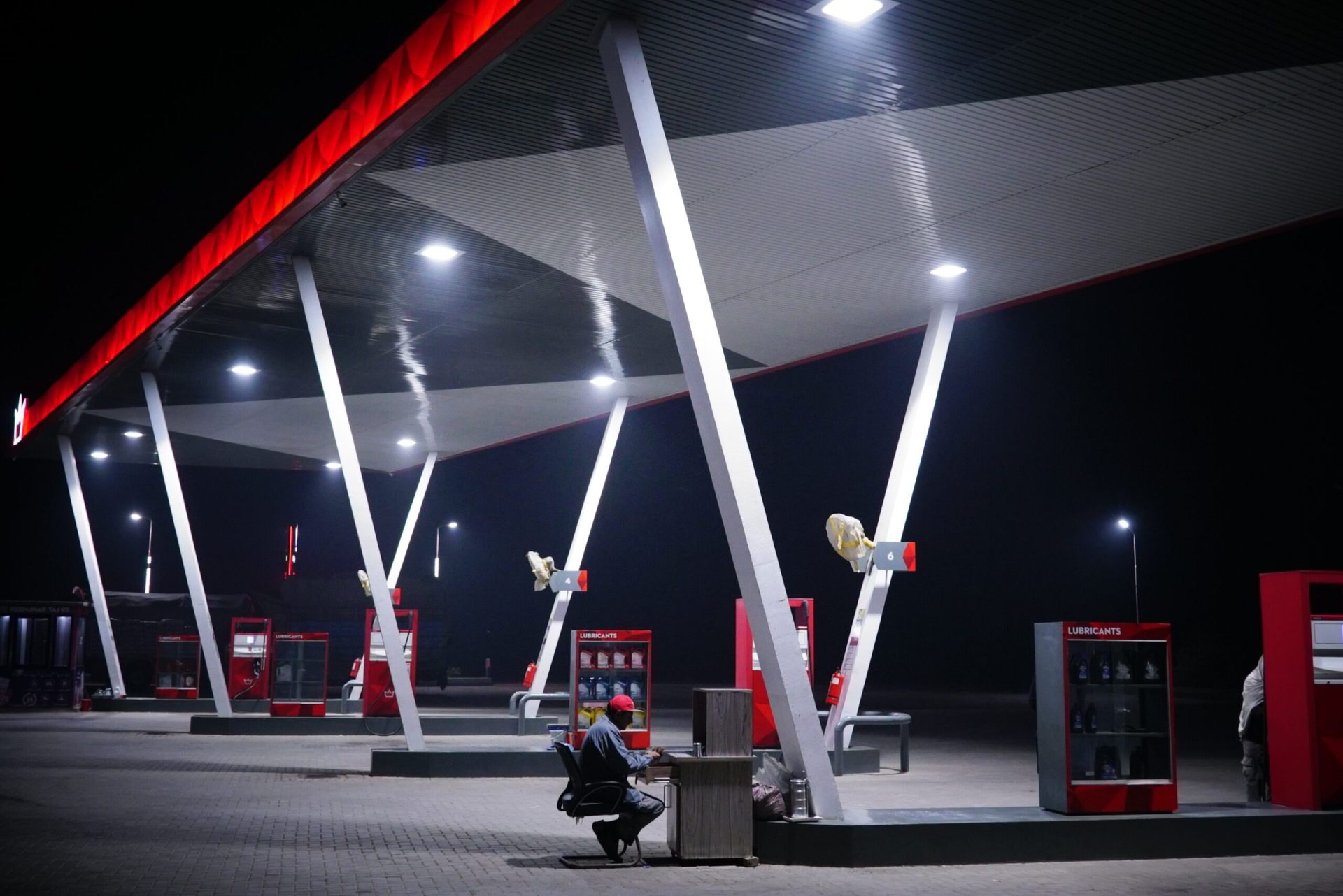 A fuel station forecourt at night